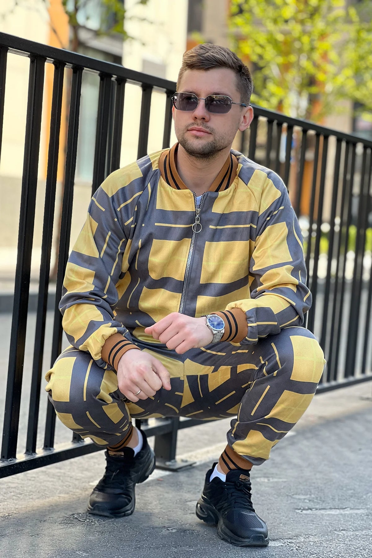 Black and Yellow Windowpane Tracksuit — crouching pose