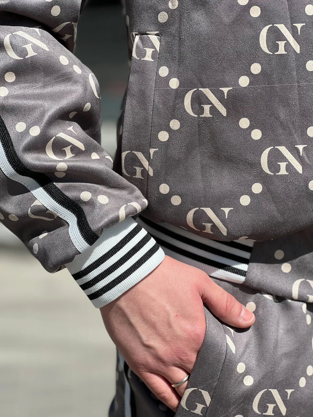 Graphite Monogram Gentlemen Tracksuit — close-up of the cuff and pocket