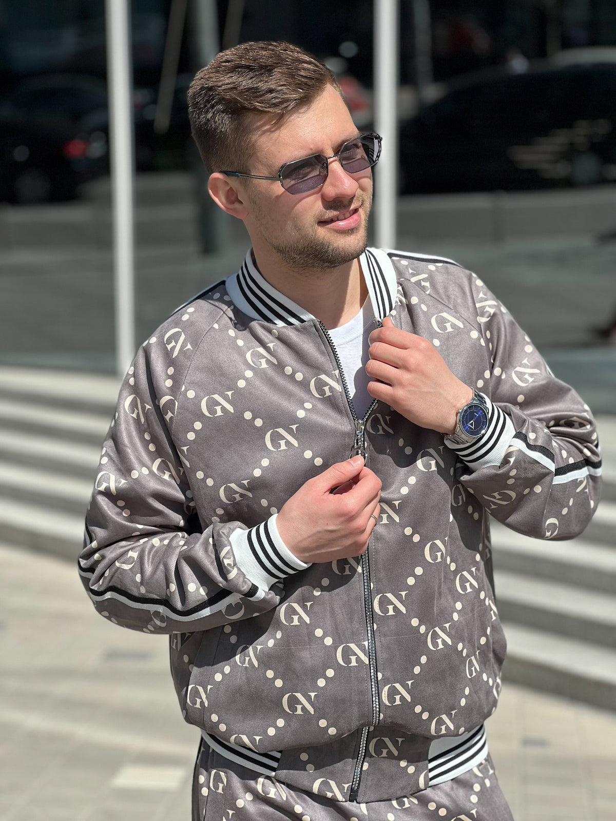 Graphite Monogram Gentlemen Tracksuit — close-up of the bomber jacket, three-quarter view