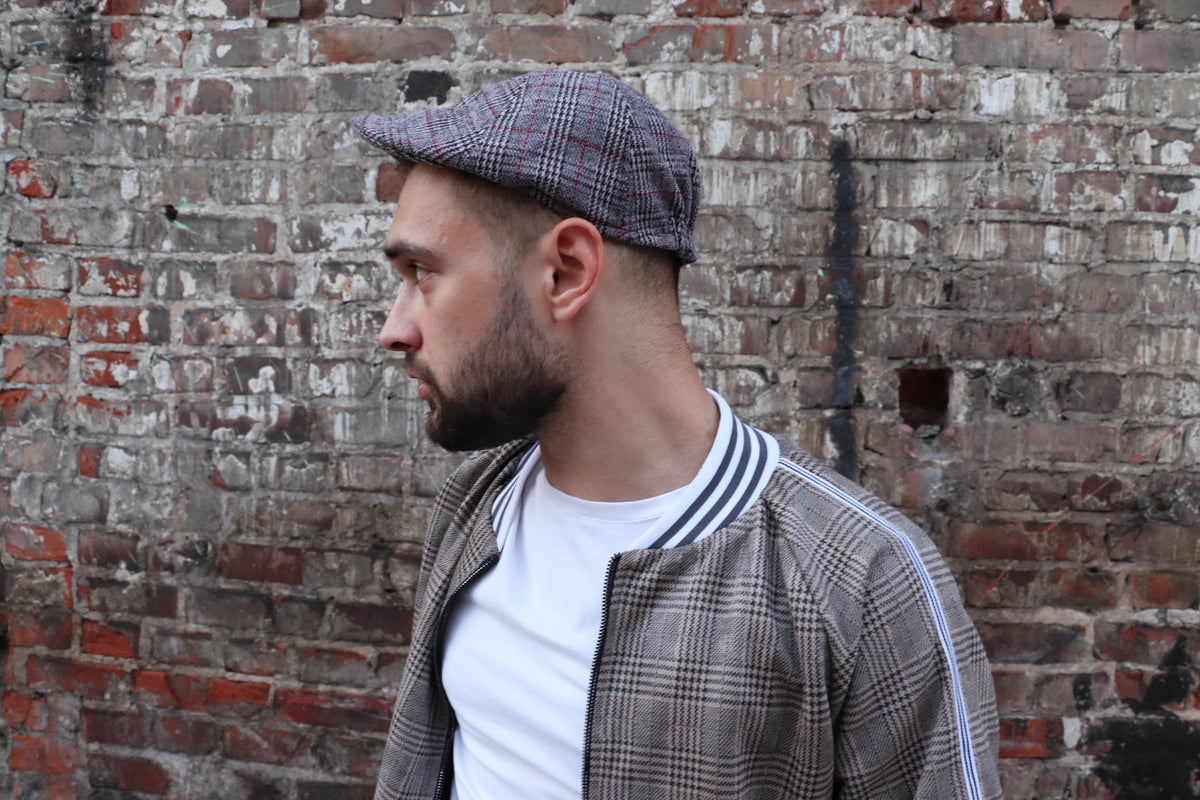 Brown Glen Plaid Flat Cap — on the model, side view, another angle
