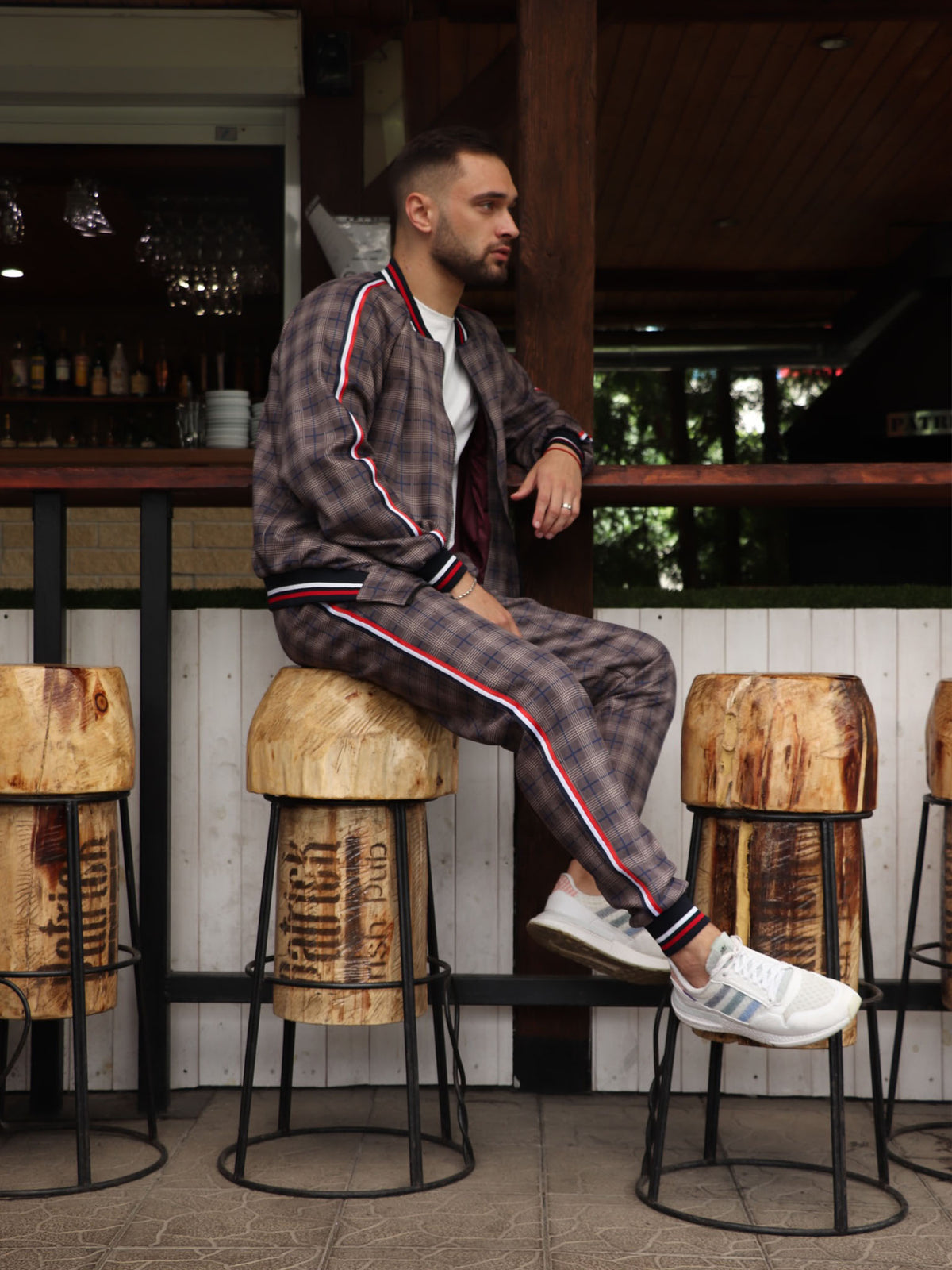 Brown & Grey Plaid Gentlemen Tracksuit — seated pose, another angle