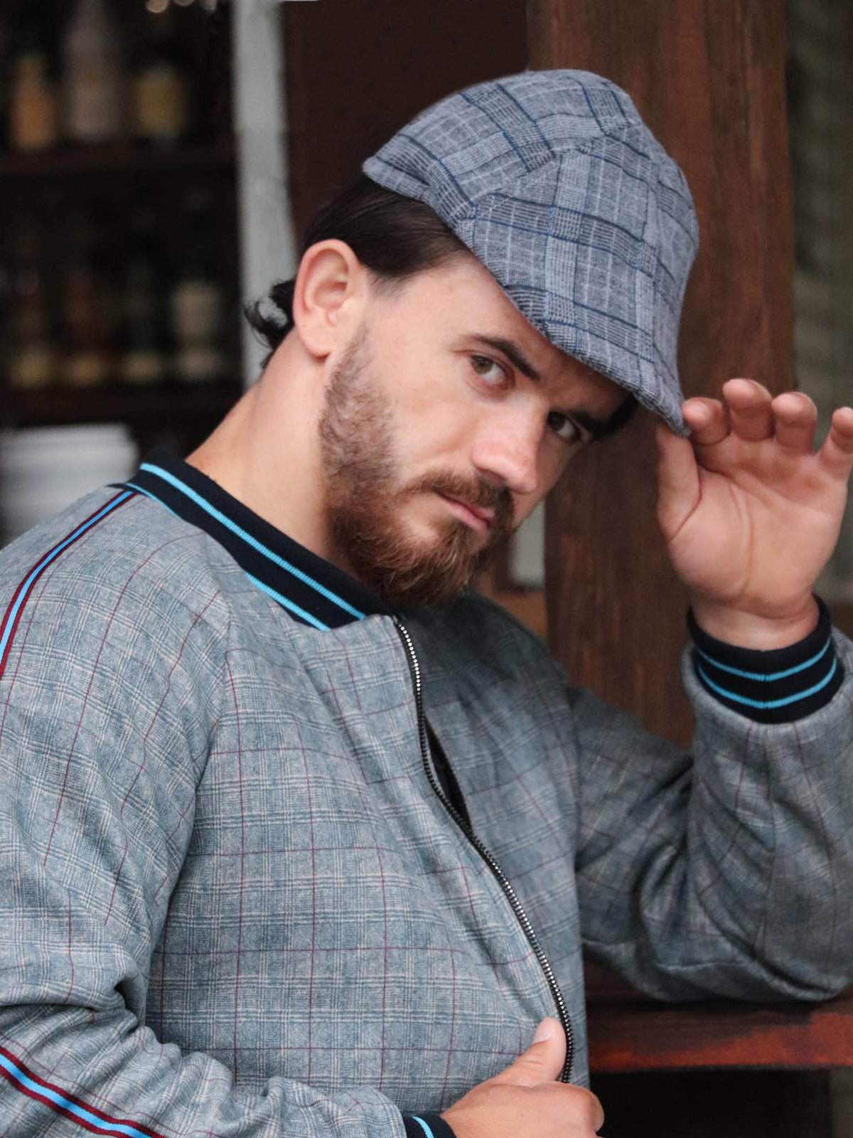 Blue Grey Plaid Flat Cap — plaid flat cap inspired by The Gentlemen, on the model