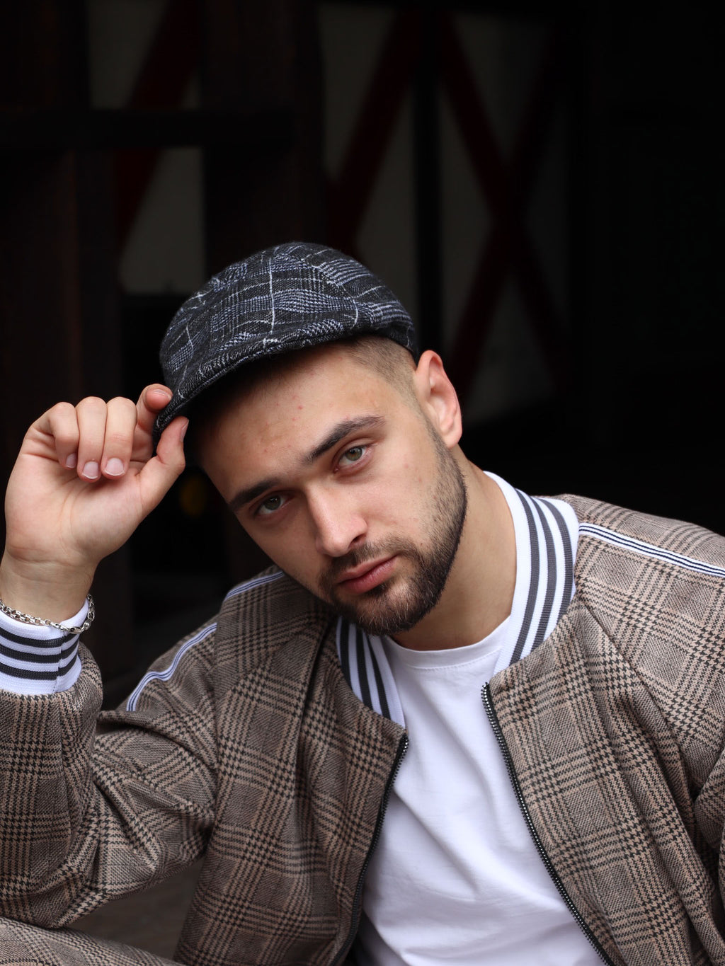 Navy Tartan Flat Cap — on the model, third angle
