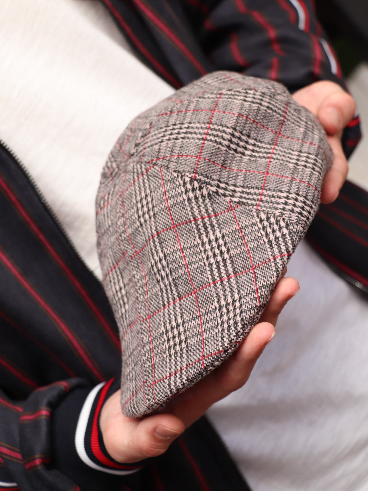 Brown Glen Plaid Flat Cap — close-up of the cap in hand