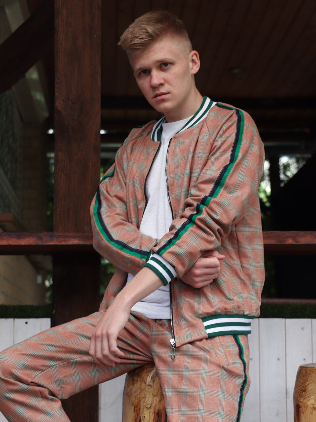 Rust Checkered Gentlemen Tracksuit — seated pose