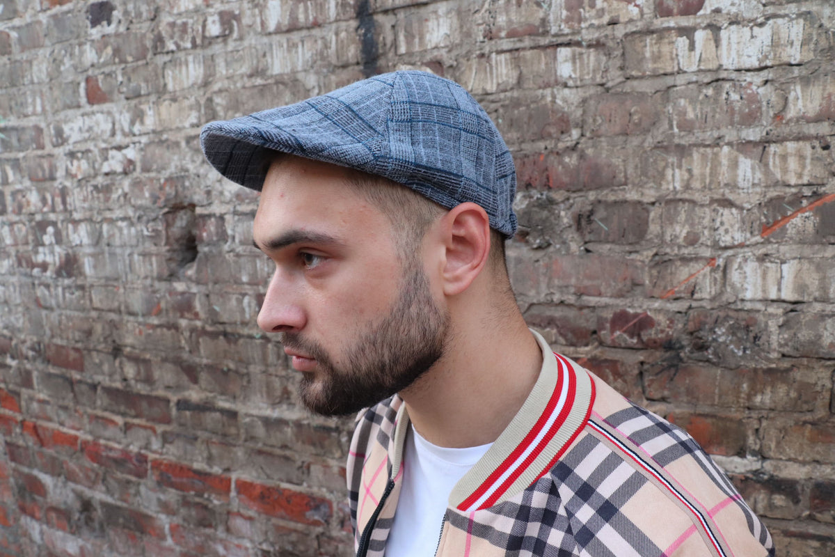 Blue Grey Plaid Flat Cap — on the model, side view