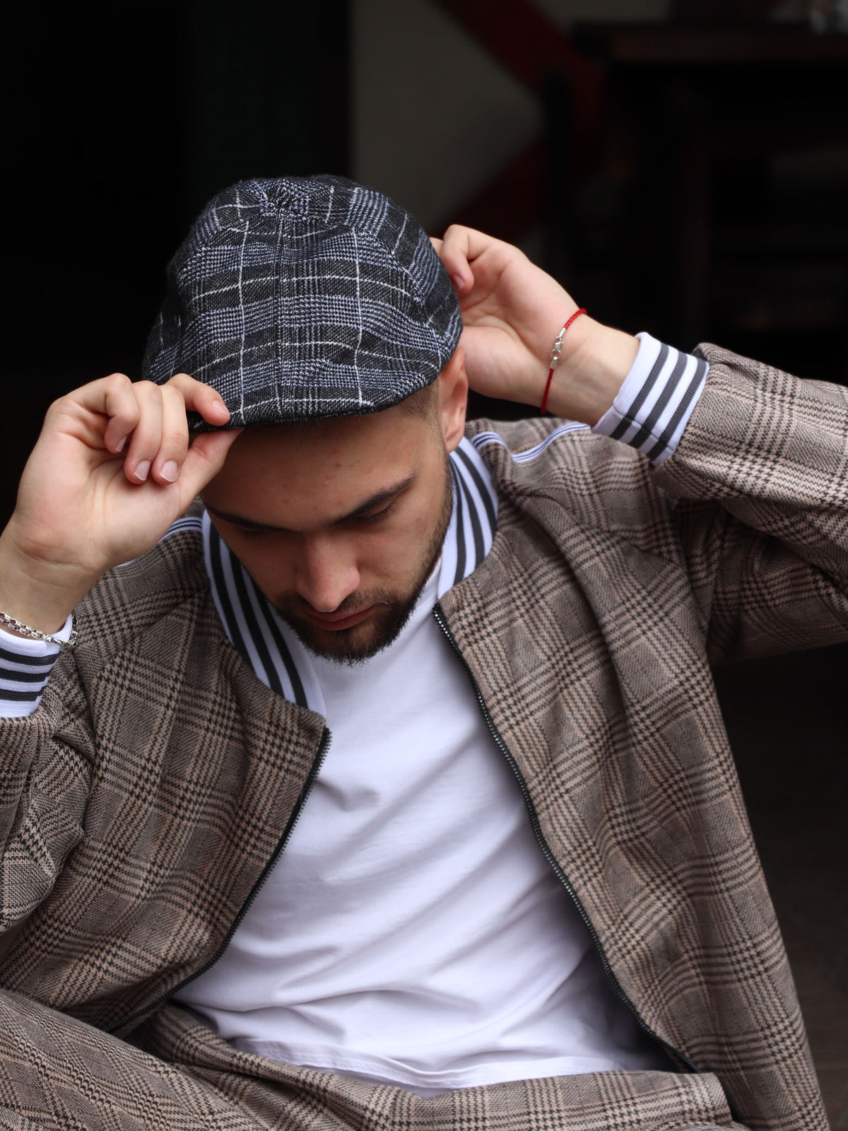 Navy Tartan Flat Cap — on the model, another angle