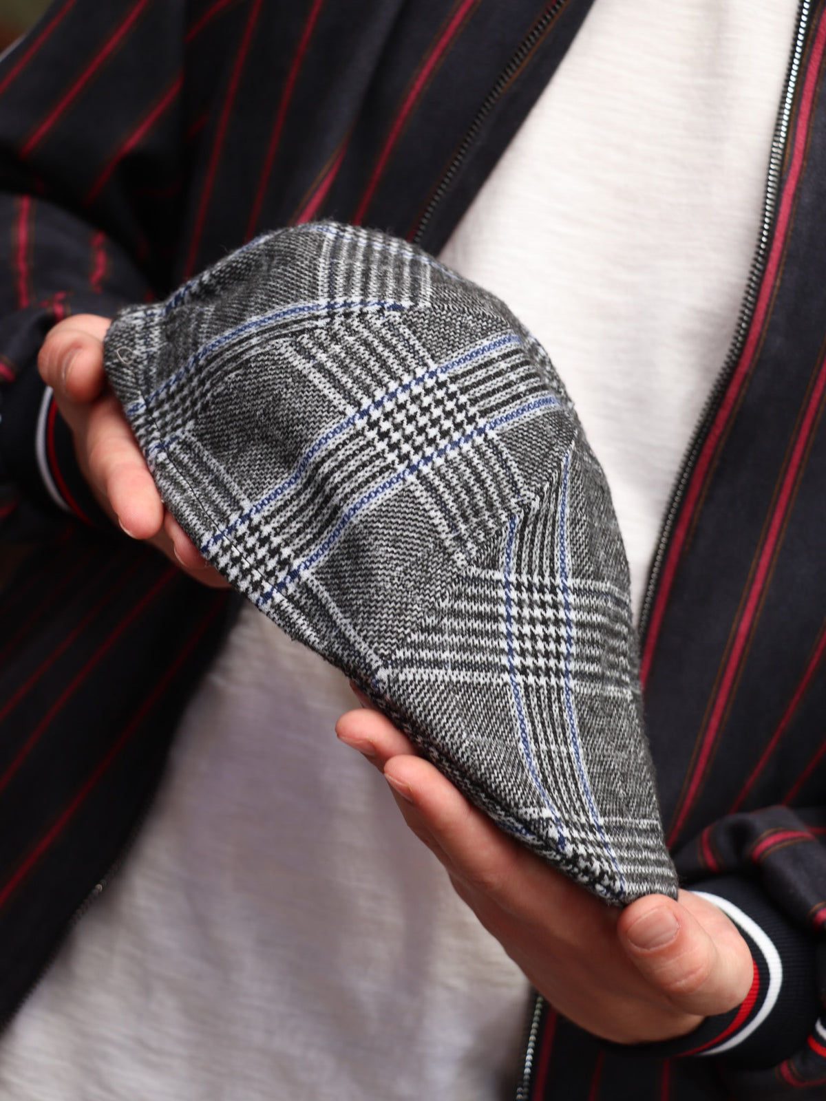 Grey Glen Plaid Flat Cap — close-up of the cap in hand