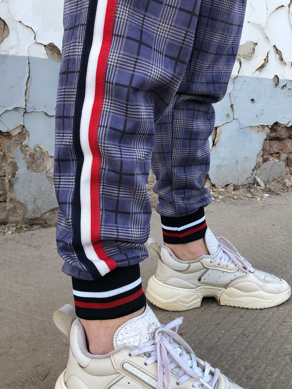 Gentlemen Tracksuit — close-up of the joggers with side stripe
