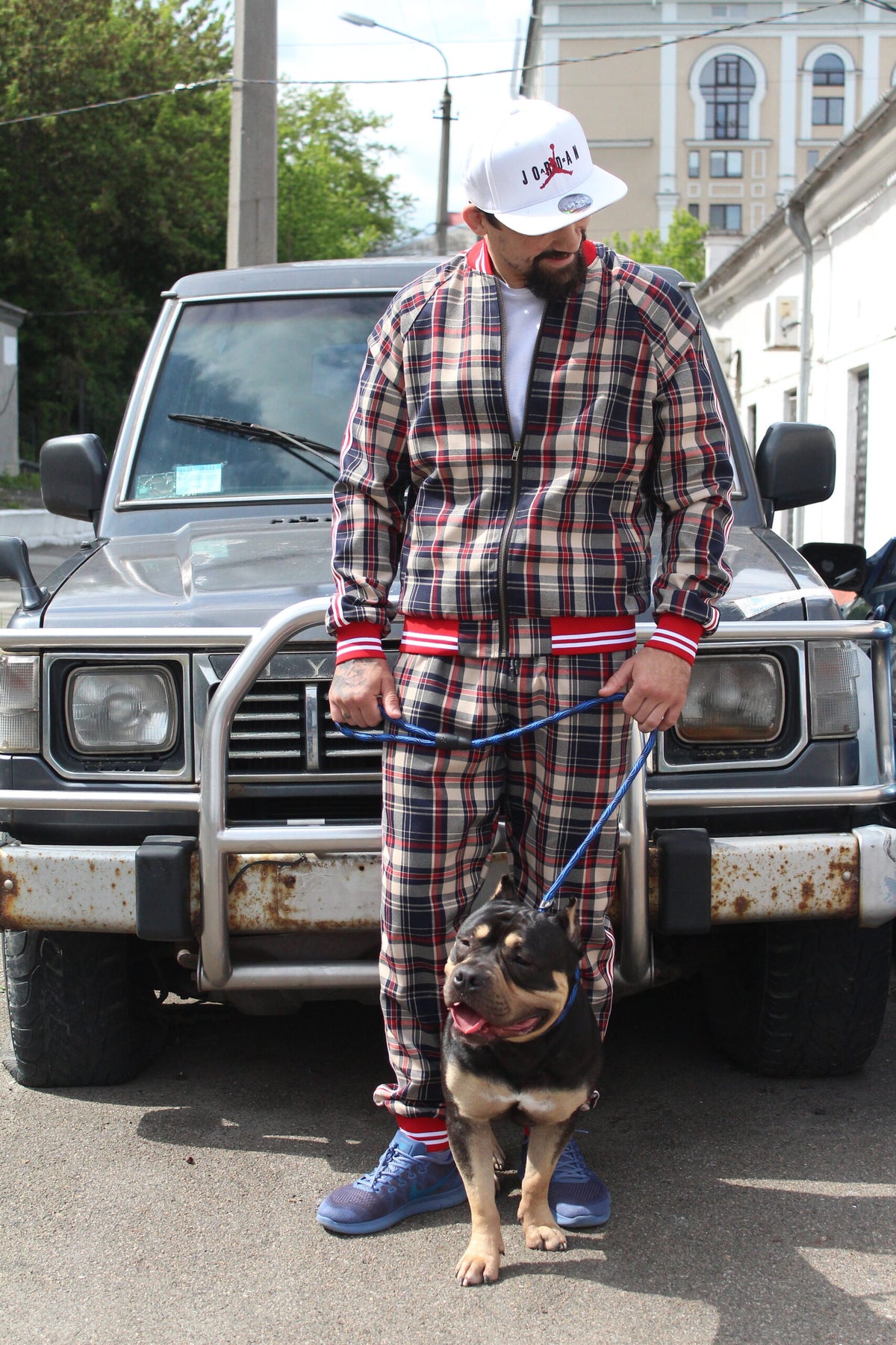 Premium Red & Beige Plaid Gentlemen Tracksuit — worn outdoors with a dog, another angle