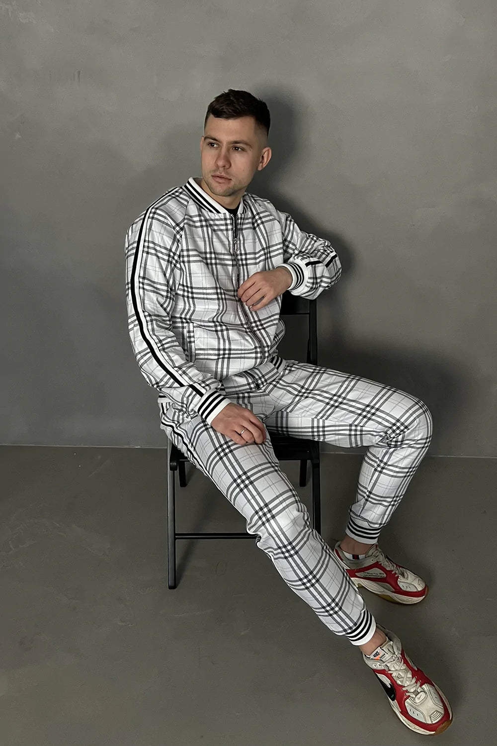 White Colin Farrell Tartan Tracksuit — seated pose