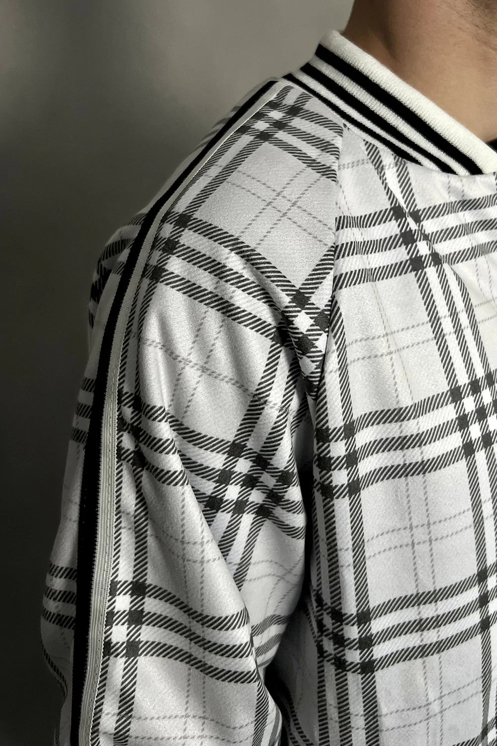 White Colin Farrell Tartan Tracksuit — close-up of the collar and zipper