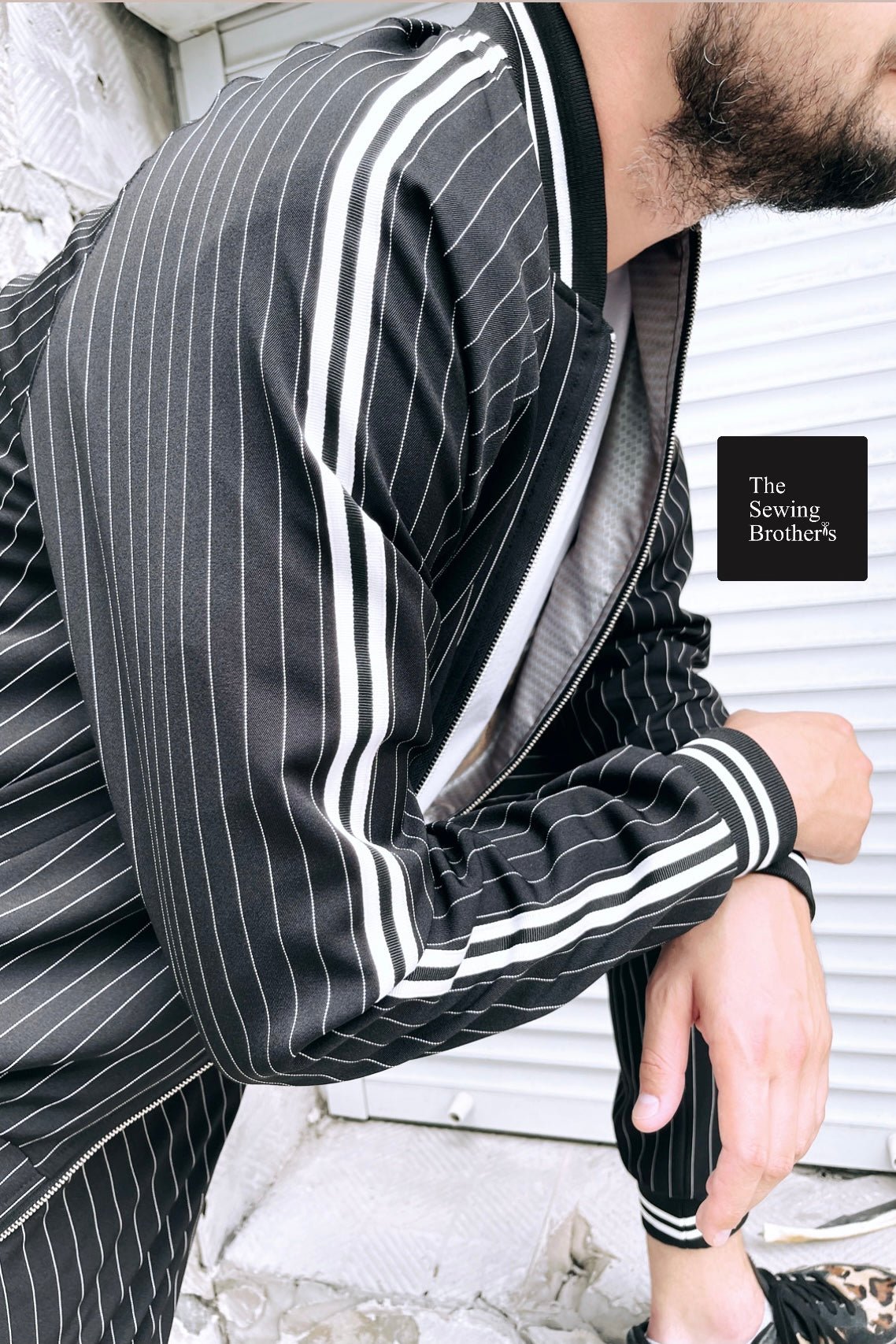 Premium Black Pinstripe Gangster Gentlemen Tracksuit — close-up of the side stripe
