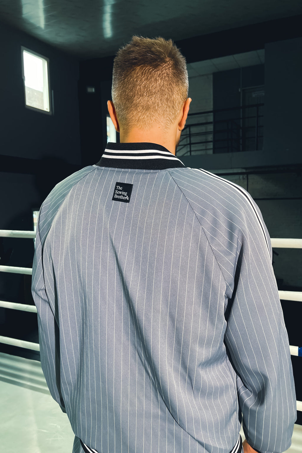 Premium Steel Blue Pinstripe Gentlemen Tracksuit — close-up of the jacket back