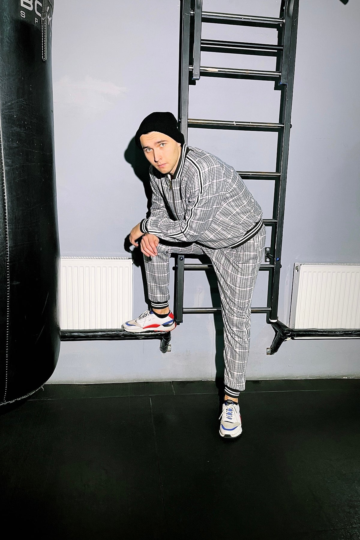 Premium Grey Houndstooth Gentlemen Tracksuit — posed with one foot raised