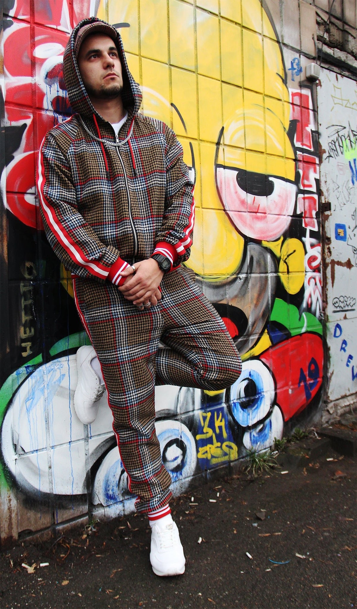 Premium Brown & Red Glen Plaid Hooded Gentlemen Tracksuit — hood up, leaning against a wall