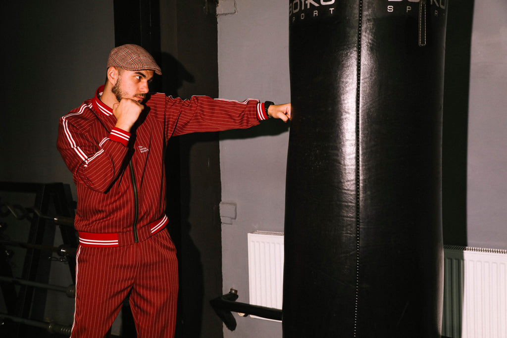 Premium Red Pinstripe Coach Gentlemen Tracksuit — boxing pose
