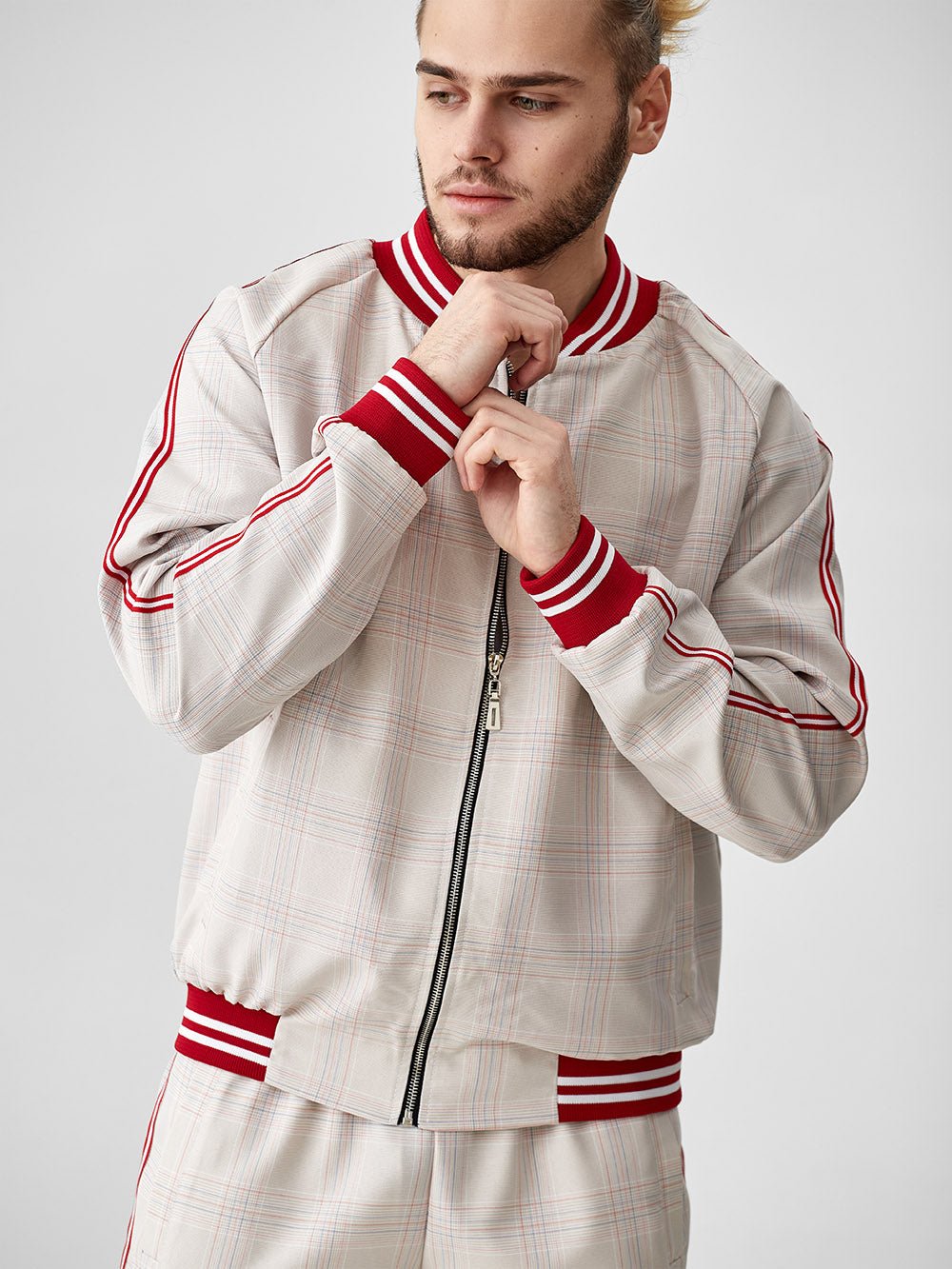 Ivory Glen Plaid Gentlemen Tracksuit — close-up of the bomber jacket, three-quarter view