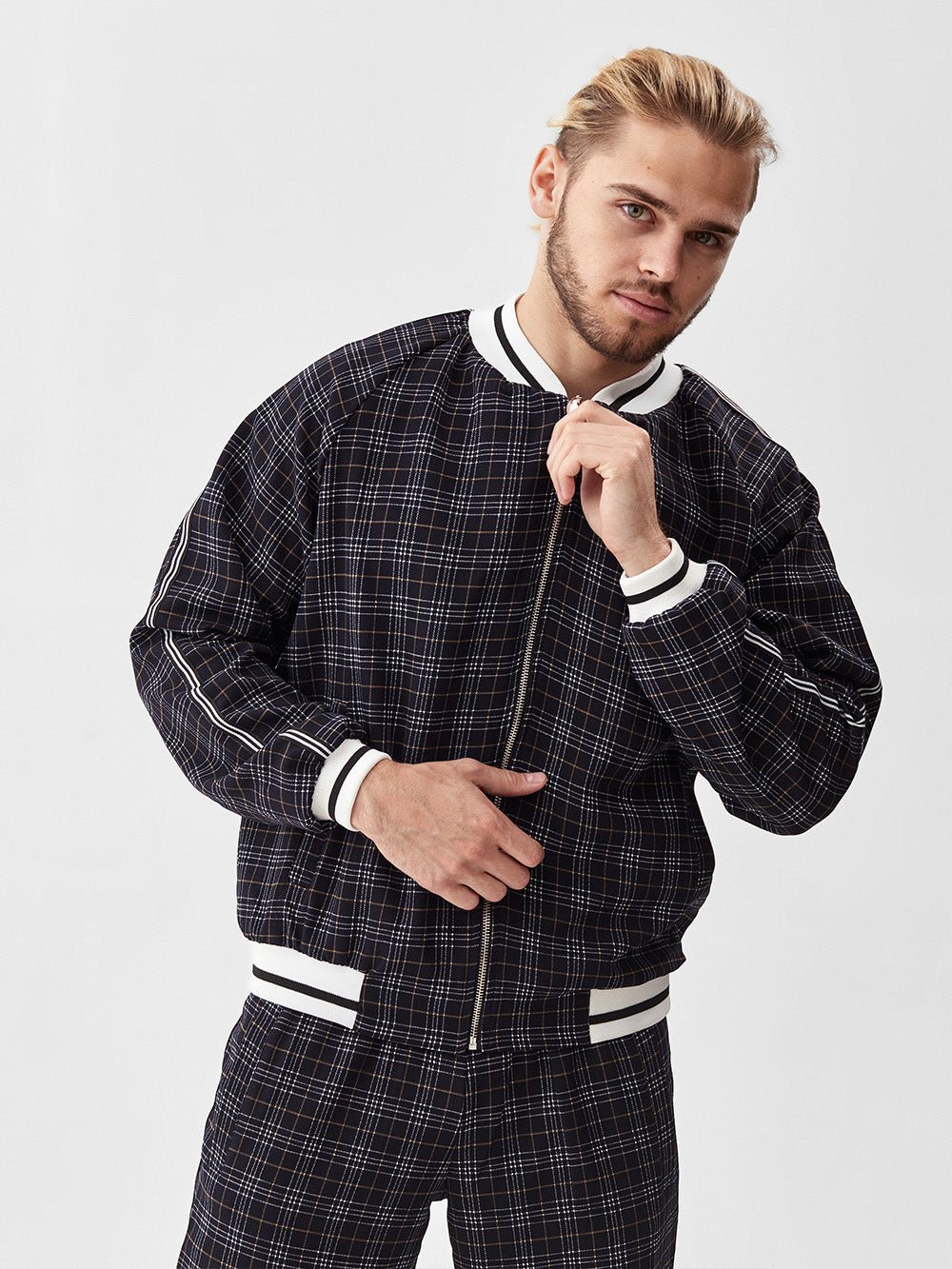 Charcoal Plaid Gentlemen Tracksuit — close-up of the bomber jacket, three-quarter view