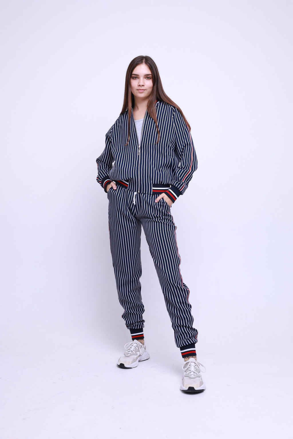 Women's Navy Pinstripe Tracksuit — pinstripe bomber jacket and joggers inspired by The Gentlemen, front view