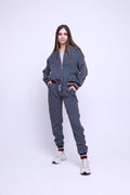 Women's Navy Pinstripe Tracksuit — pinstripe bomber jacket and joggers inspired by The Gentlemen, front view